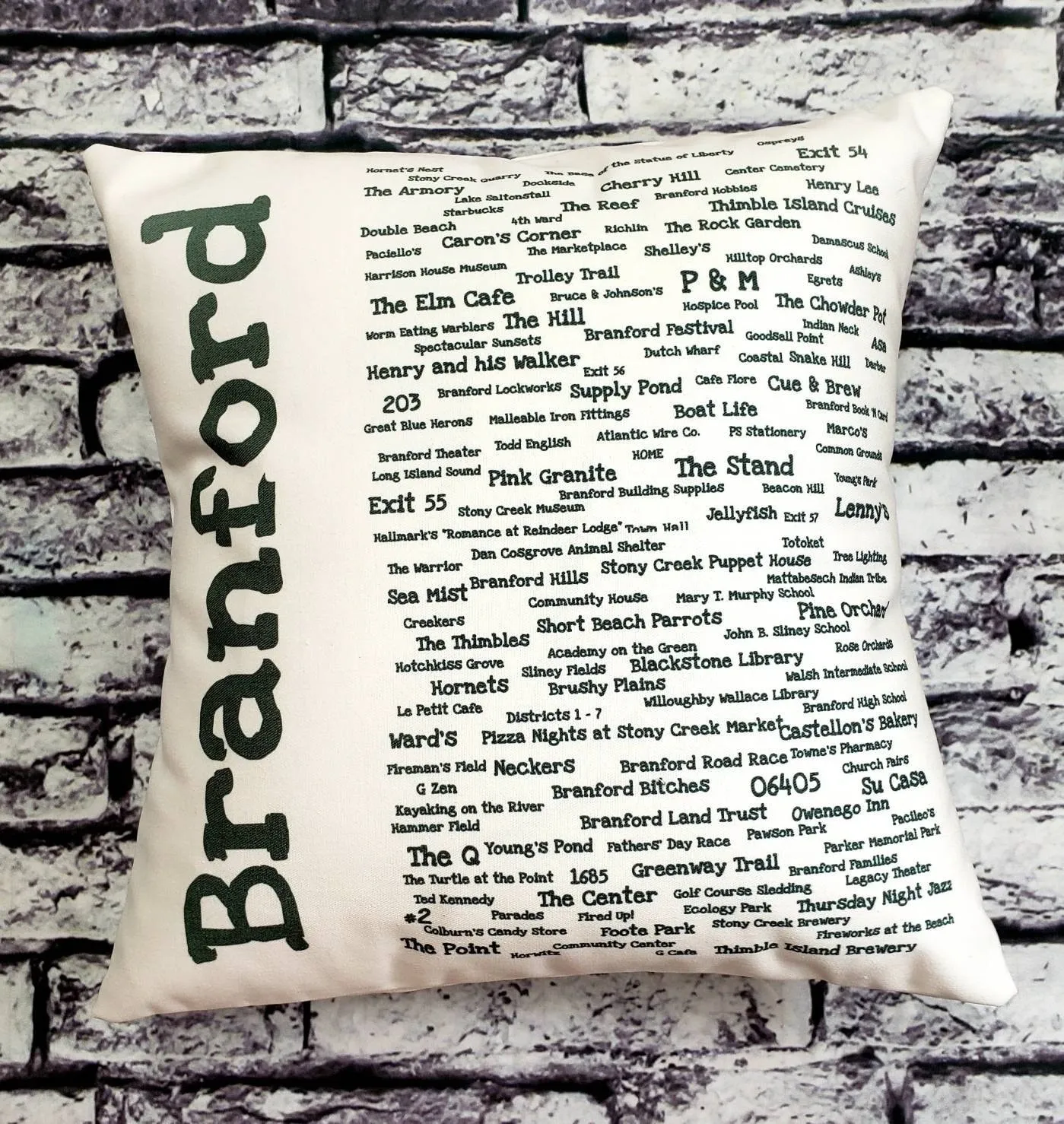 A pillow with the name of branford written in many different languages.