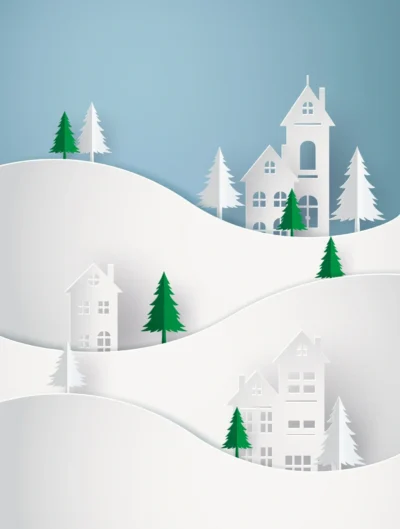 A paper cut of houses and trees on the side of a hill.