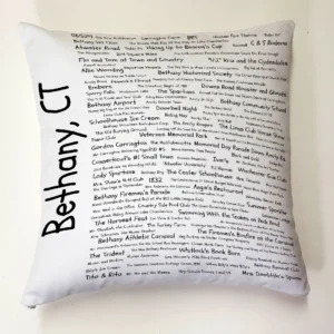 A pillow with the names of many people in it.