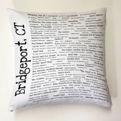 A white pillow with the words bridgeport ct written on it.