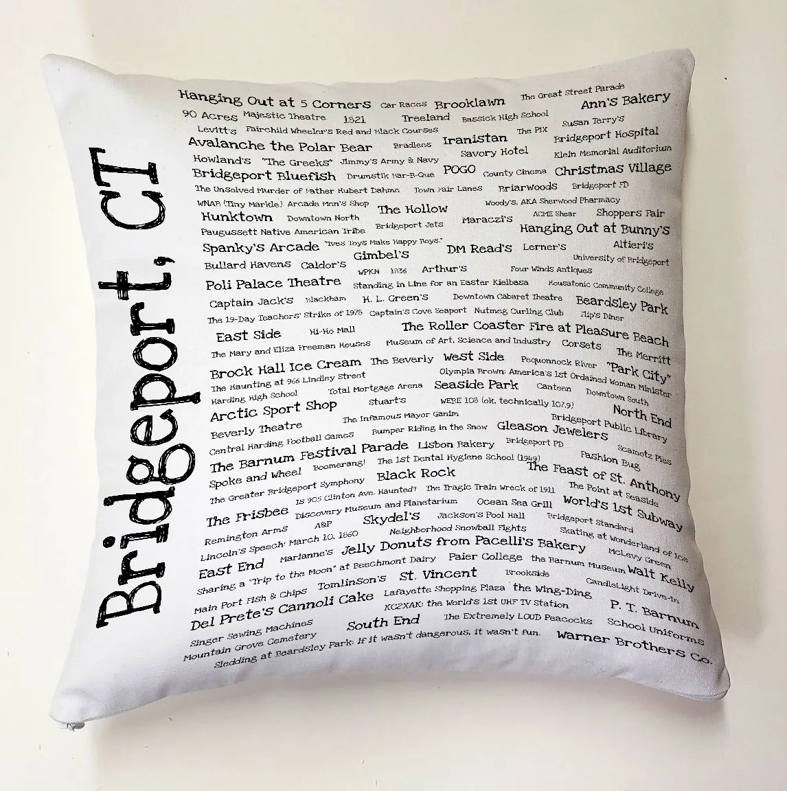 A white pillow with the words bridgeport ct written on it.