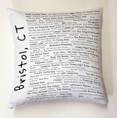 A pillow with the words bristol, ct written on it.