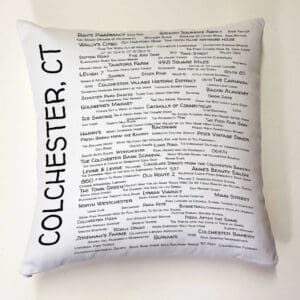 A white pillow with the words colchester, ct written on it.