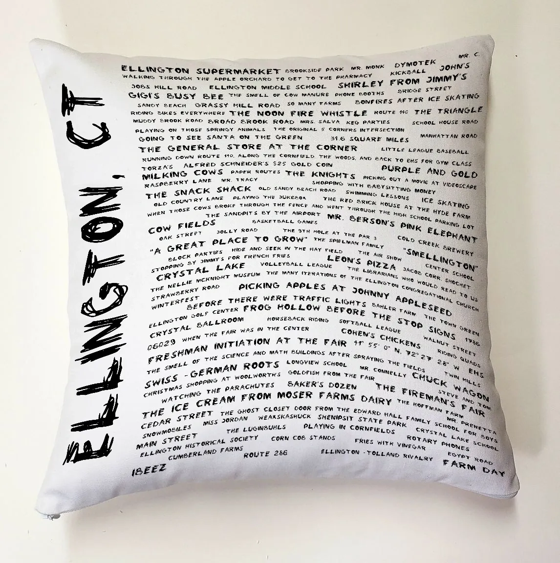 A pillow with the words ellington ct written on it.