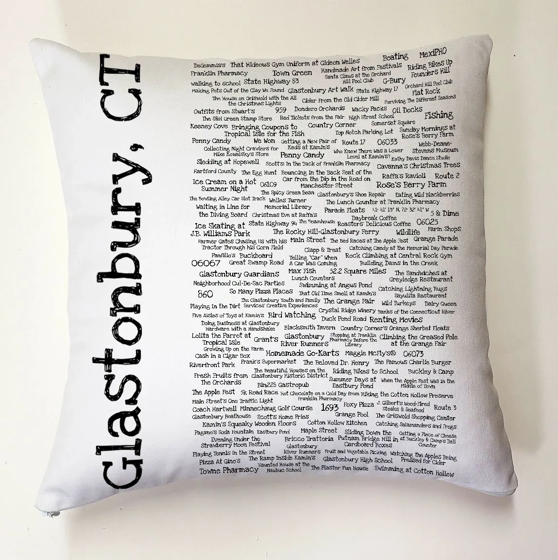 A pillow with the words glastonbury, ct written on it.