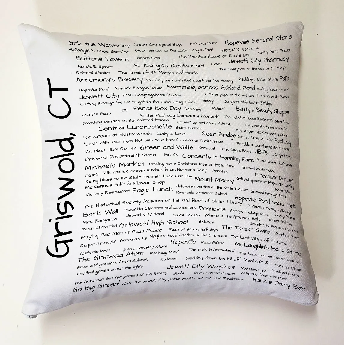 A pillow with the words " griswold ct ".