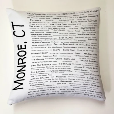 A pillow with the names of all the places in monroe, ct.