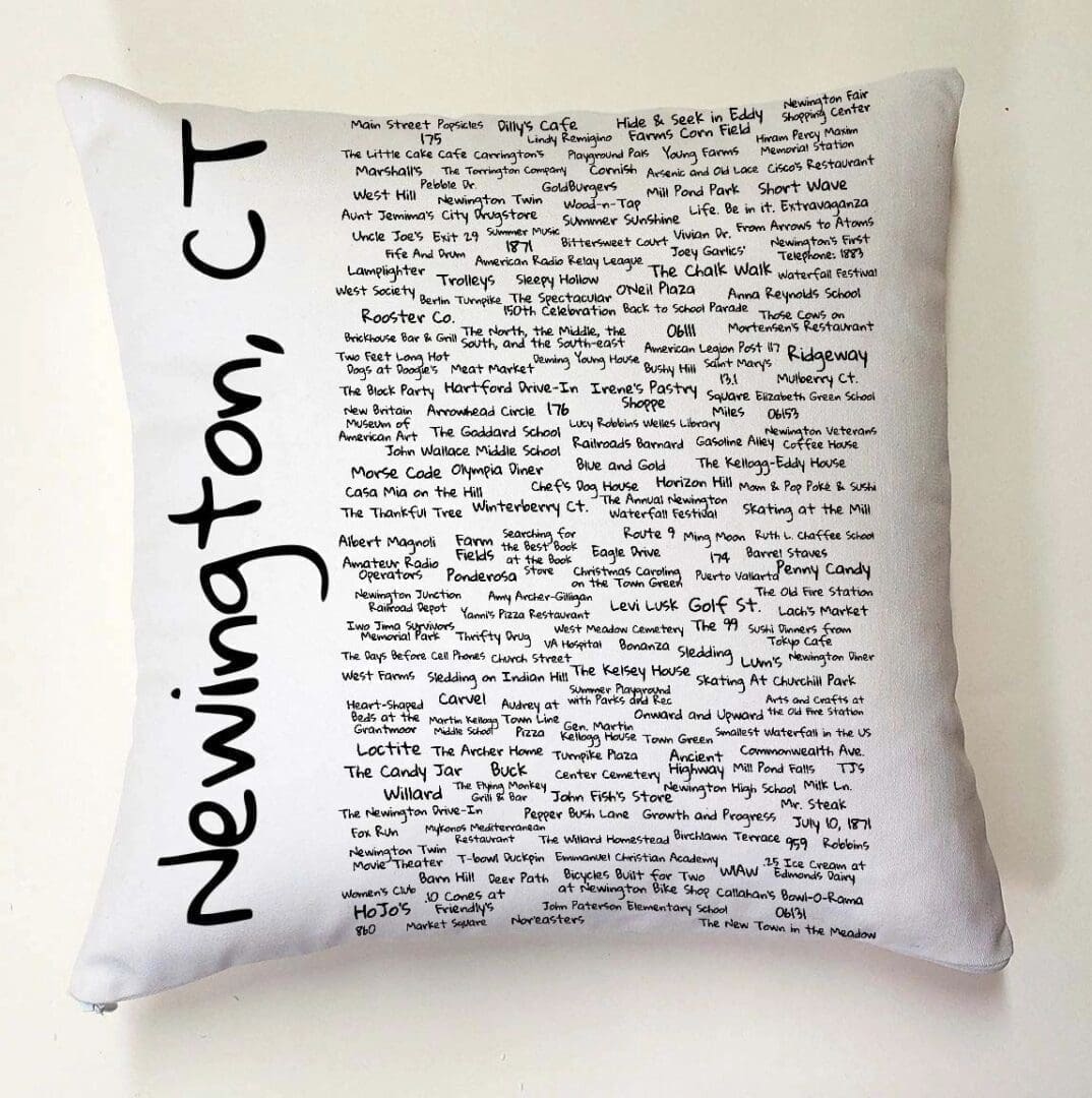 A pillow with the words newington ct written on it.