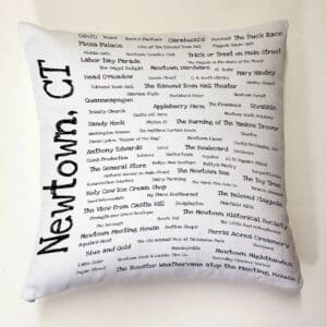 A pillow with the words newtown, ct written on it.