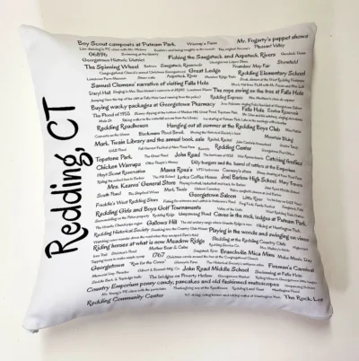 A pillow with the names of many people in it.