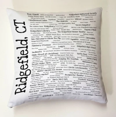 A white pillow with the words " ridgefield, ct ".