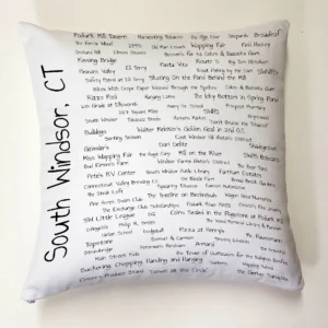 A pillow with the names of many different places.