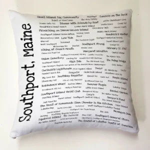 A white pillow with black writing on it.