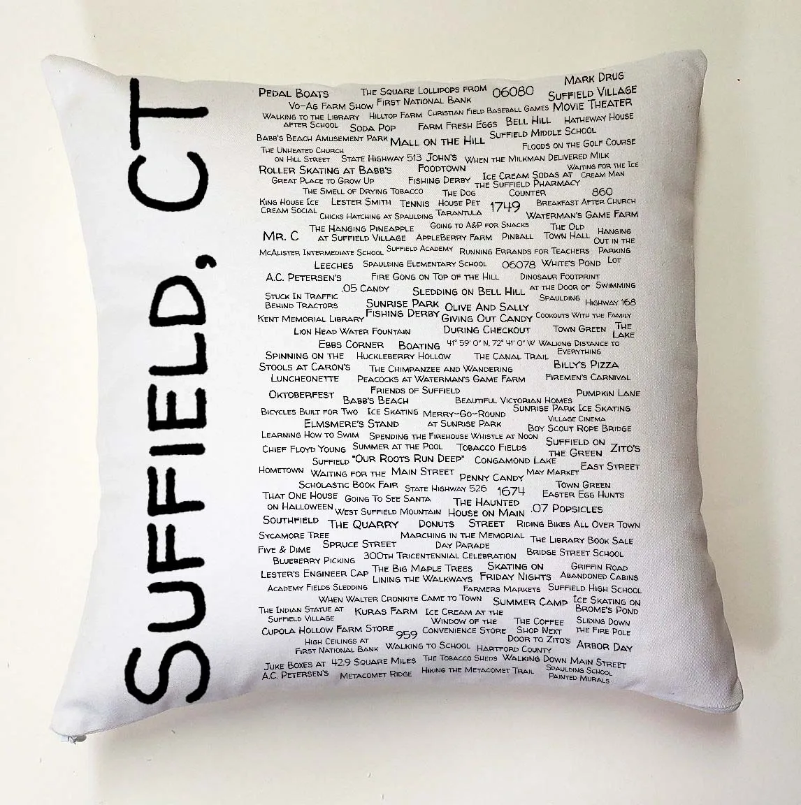 A pillow with the words suffield, ct written on it.