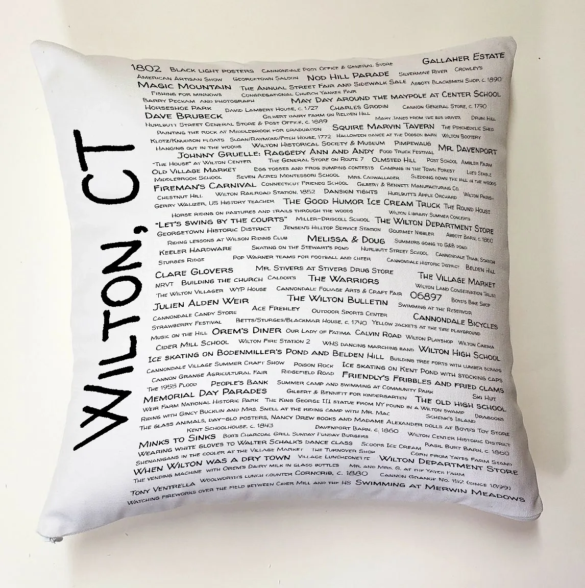 A pillow with the words " wilton ct ".