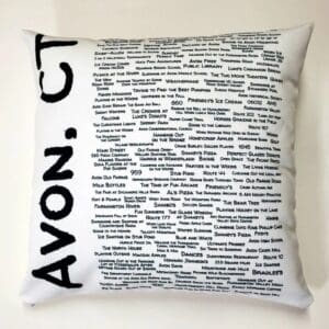 A pillow with the word avon on it.