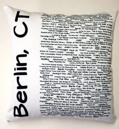 A pillow with the words berlin, ct written on it.