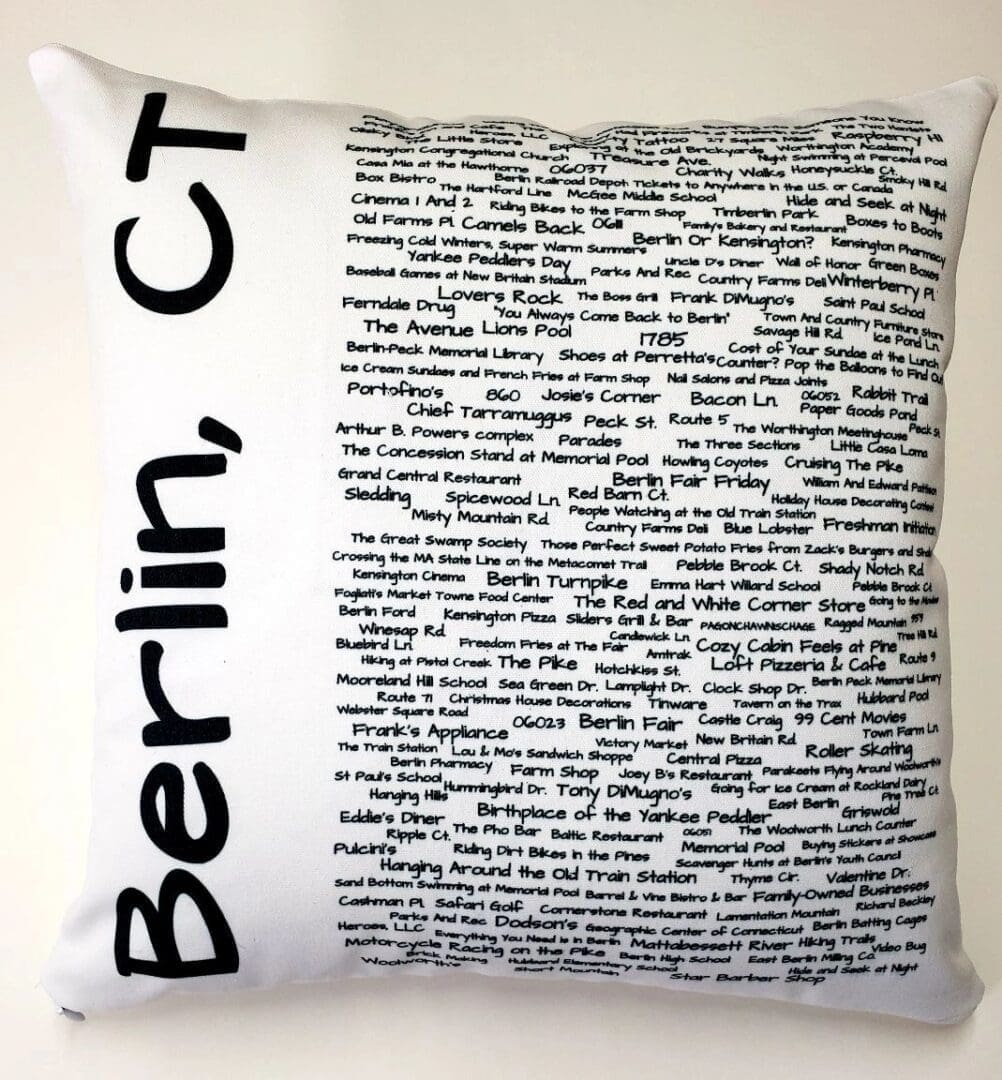 A pillow with the words berlin, ct written on it.