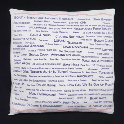 A pillow with many words written on it