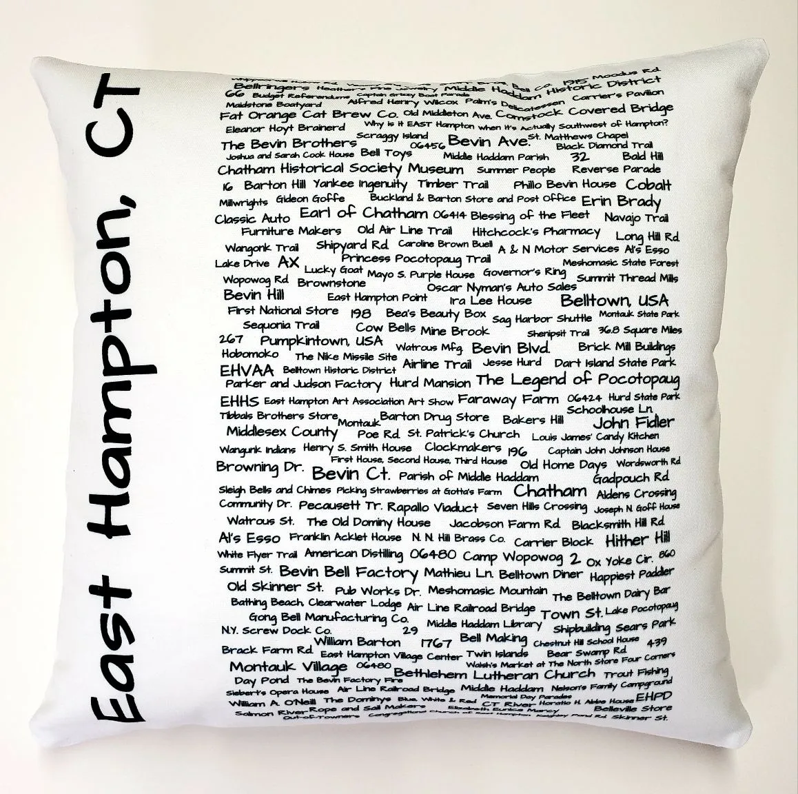 A pillow with the words east hampton, ct written on it.