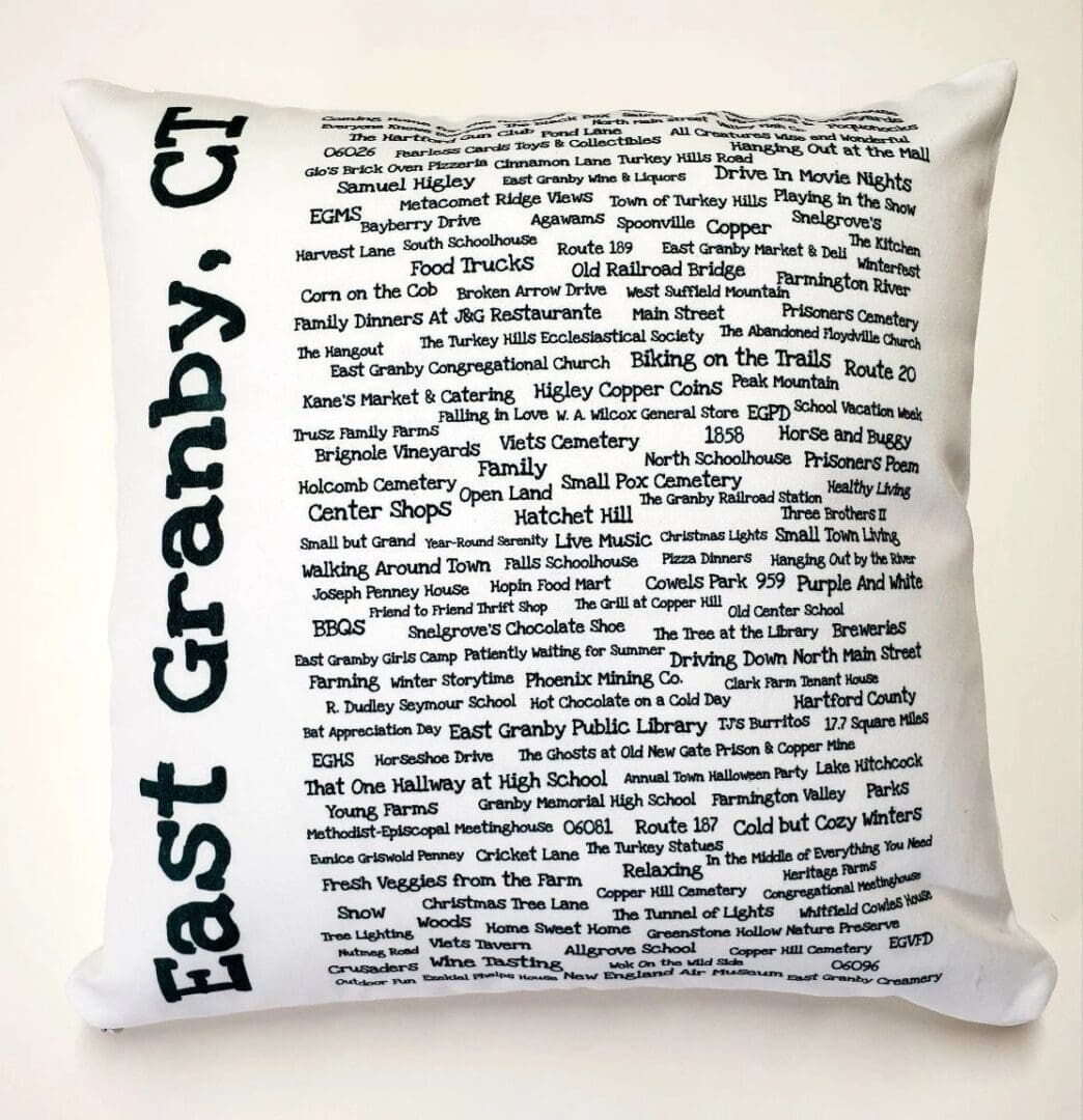 A pillow with the words east granby, ct. Written in black ink on it