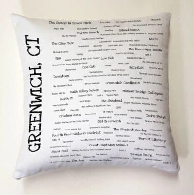 A pillow with the words greenwich, ct written on it.