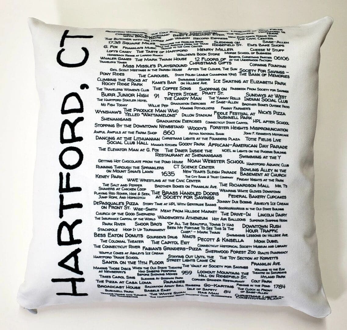 A white pillow with the words hartford, ct written in black.