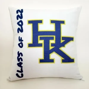 A pillow with the letters h and k on it.