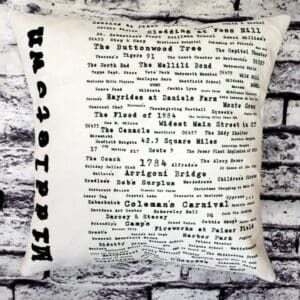 A pillow with the word " hoboken ".