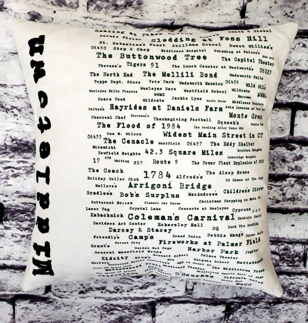 A pillow with the word " hoboken ".