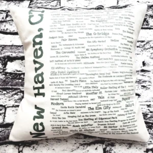 A pillow with the words " new haven, ct." written on it.