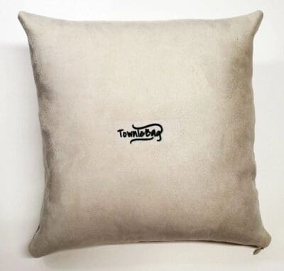 A pillow with the word " truthful " embroidered on it.