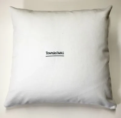 A white pillow with the words " designable ".