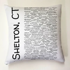 A pillow with the names of all the places in shelton, ct.