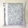 A white pillow with black writing on it.