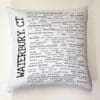 A white pillow with many words written on it.