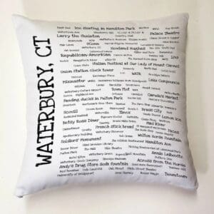 A white pillow with many words written on it.