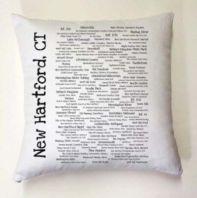 A pillow with the words " new hartford, ct ".