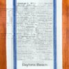 A blue striped towel with trivia about Daytona Beach, Florida