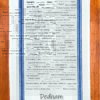 A blue striped towel with trivia about Dedham, Massachusetts