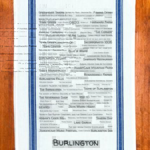 A blue striped towel with trivia about Burlington, Connecticut